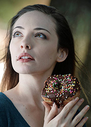 Photo of Lauren Keys with a donut