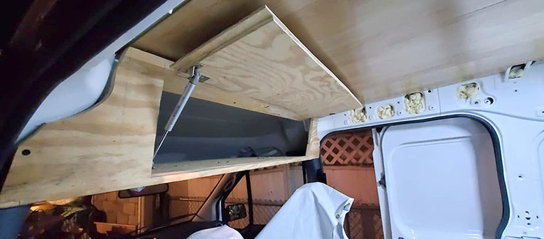 Photo of overhead storage in Ford Transit Connect camper van