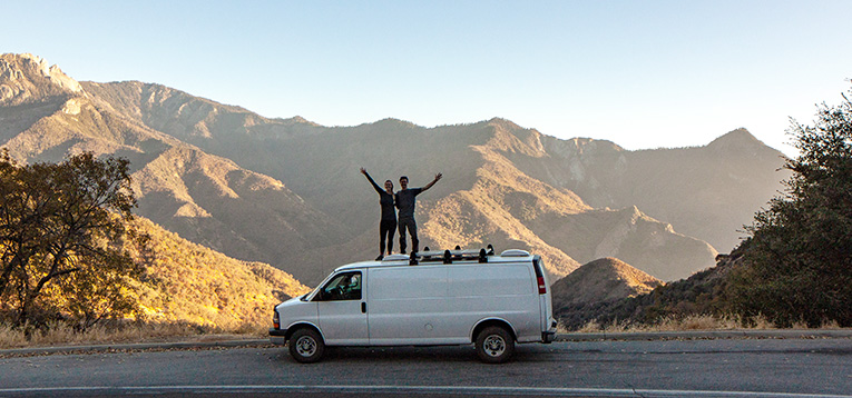Photo of Eric and Ashley with their Chevy Express van